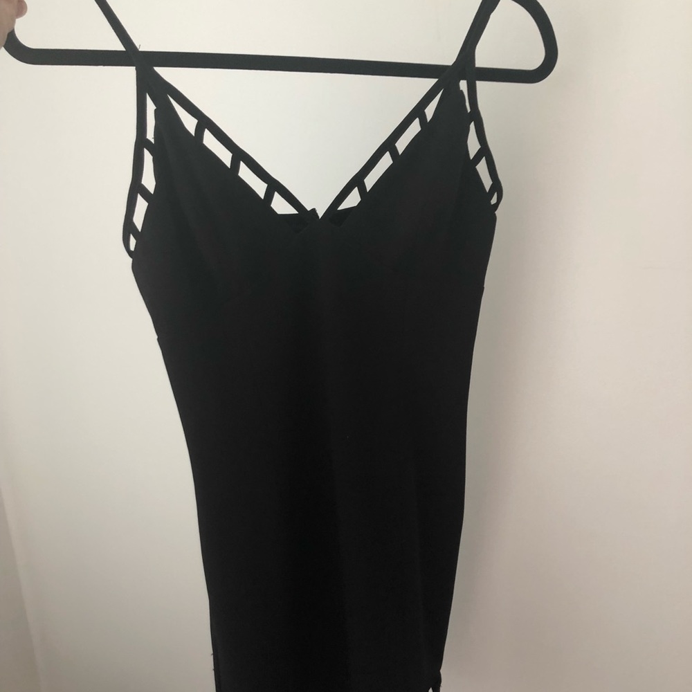 Sexy black dress with adorable slits. Great fit
